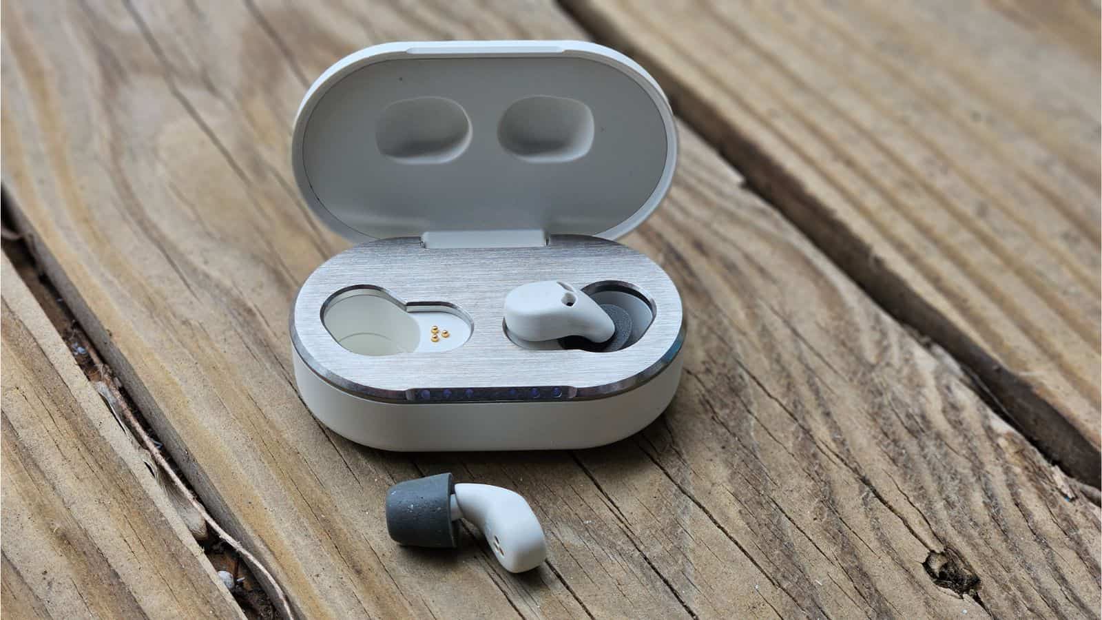 review: quieton 3.1 sleep earbuds Quieton 3. 1 one earbud in case, one earbud on wood