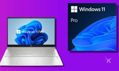 A laptop with a netbook and a personal computer connected to an output device display the windows 11 pro operating system on the computer screen.