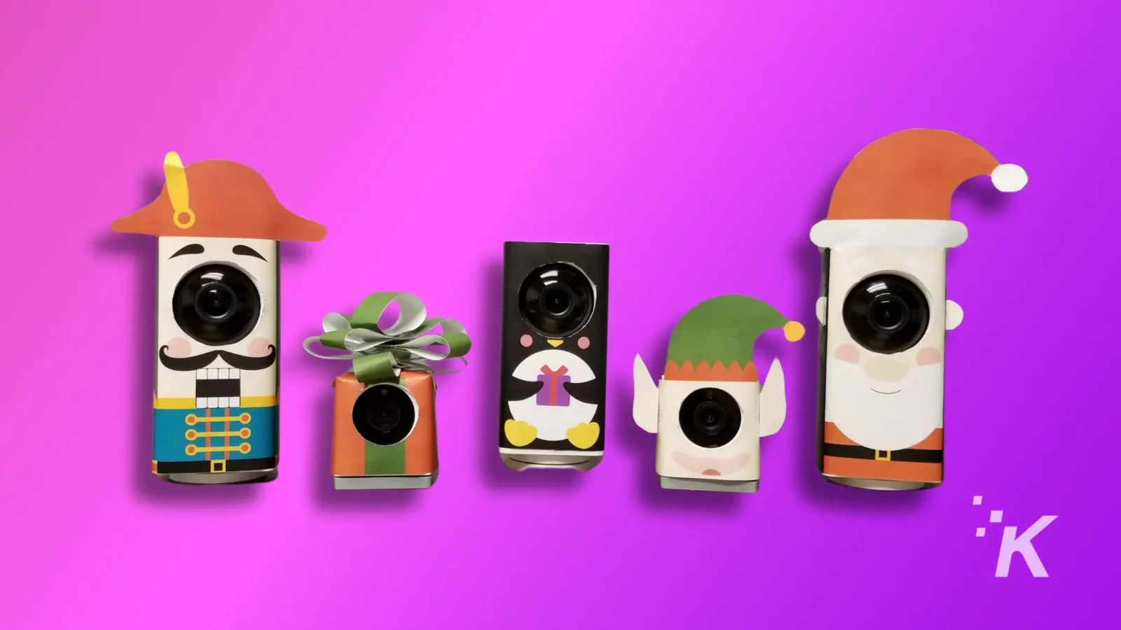 top 5 places to hide a wyze camera on your property Five creatively decorated cameras on a purple background, adorned with costumes resembling a pirate, present, nun, elf, and santa claus.